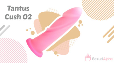 Tantus Cush O2 pink silicone sex toy on a decorative background